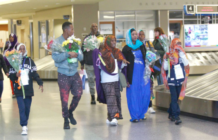 The family of Somane Liban, refugees from Somalia, walk through the Boise Airport after being met by their US-based family members on arrival in Boise, Idaho, on Friday. — Reuters