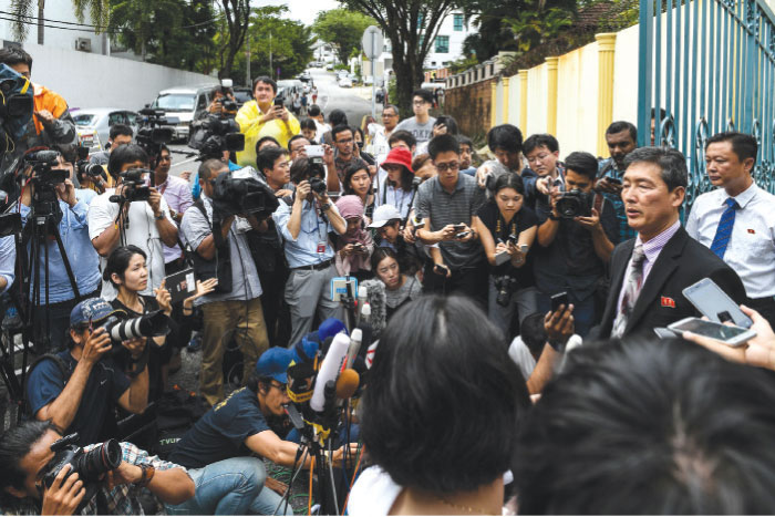 Former North Korean deputy ambassador to the United Nations Ri Tong Il (2nd R) addresses journalists outside the North Korean Embassy in Kuala Lumpur, Thursday.  The only North Korean arrested over the dramatic airport assassination of Kim Jong-Nam is to be deported, Malaysia said, as it announced the abrupt cancellation of a visa-waiver program with Pyongyang. — AFP