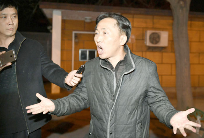 North Korean Ri Jong Chol speaks in front of reporters at the North Korean Embassy in Beijing on Saturday. — AP
