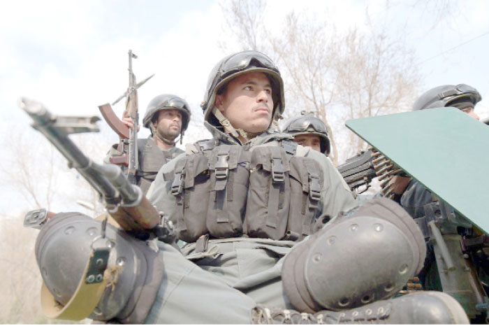 Afghan policemen arrive at the site of an explosion in Kabul on Wednesday. — AFP