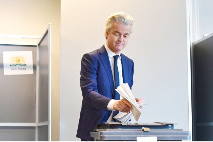 Netherlands’ politician Geert Wilders of the Freedom Party (PVV) casts his ballot for Dutch general elections at a polling station in The Hague on Wednesday. — AFP