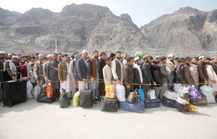 Afghan citizen wait to cross into their home country at the border post in Torkham, Pakistan, in this March 7, 2017 file photo. — Reuters