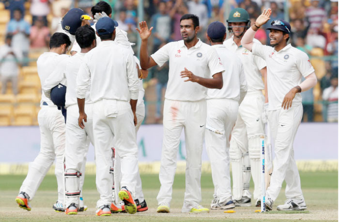 India’s Ravichandran Ashwin (4th R) celebrates with teammates after winning the Second Test cricket match against Australia in Bengaluru. – Reuters