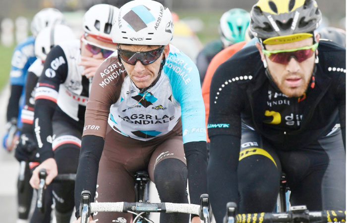 France’s Romain Bardet (C) rides in the pack during the 148,5km first stage of the 75th edition of the Paris-Nice cycling race, in and around Bois d’Arcy, near Paris on Sunday. — AFP