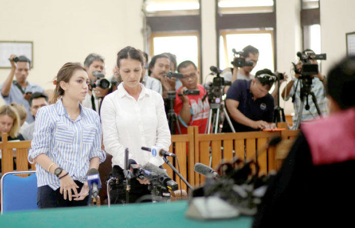 Australian national Sara Connor stands beside her translator in a courtroom during sentencing for her role in the death of a police officer at the Denpasar District Court in Bali, Indonesia, on Monday. — Reuters