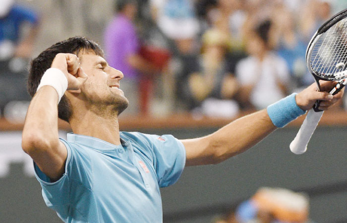 Novak Djokovic of Serbia celebrates after his straight sets victory against Kyle Edmund of Great Britain at Indian Wells Tennis Garden on Sunda in Indian Wells, California. — AFP