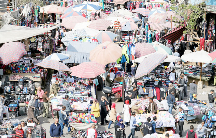 People shop at Al-Ataba, a popular market in downtown Cairo. — Reuters