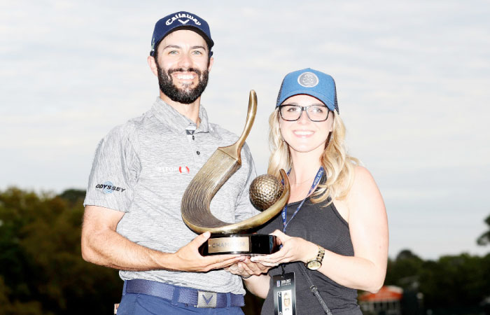 Adam Hadwin of Canada holds the trophy with fiancee Jessica Dawn after winning the Valspar Championship during the final round at Innisbrook Resort Copperhead Course on Sunday in Palm Harbor, Florida. — AFP