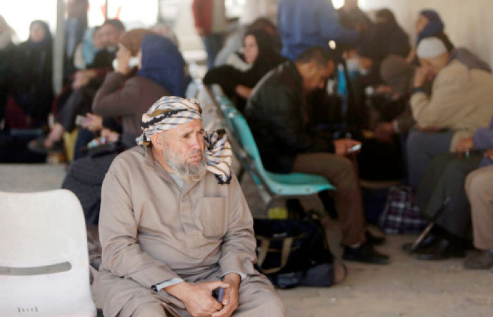 Palestinian patients wait on the Palestinian side of the Israeli border terminal of Erez, in Beit Hanun, in the northern Gaza Strip after it was shut by the Islamist movement after blaming the Jewish state for the assassination of one of its officials in the Palestinian enclave. — AFP