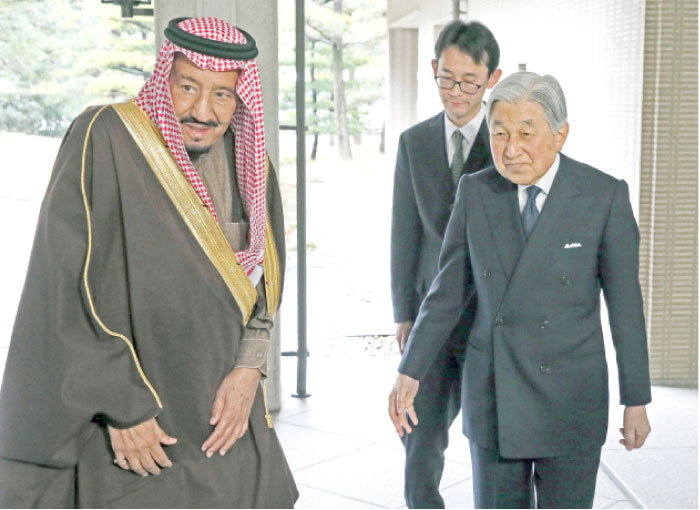 Custodian of the Two Holy Mosques King Salman is welcomed by Japan’s Emperor Akihito at the Imperial Palace in Tokyo on Tuesday. — Reuters