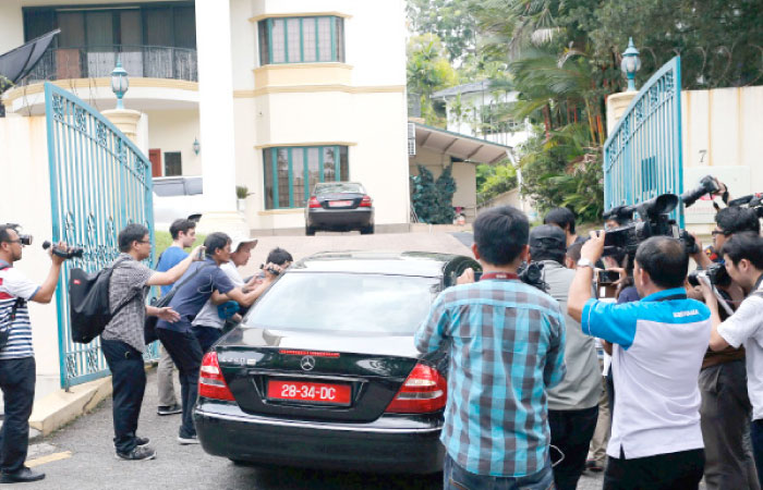 A North Korea embassy car leaves the embassy in Kuala Lumpur, Malaysia, on Tuesday. — Reuters
