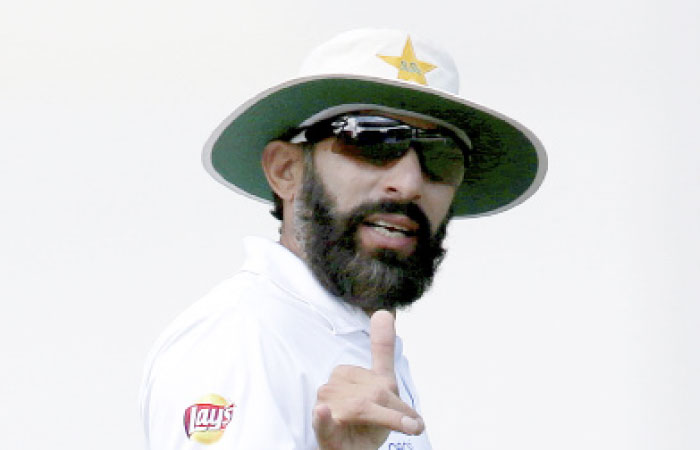 In this file photo, Pakistan’s captain Misbah-ul-Haq gestures to teammates during their cricket Test match against Australia in Sydney, Australia. — AP