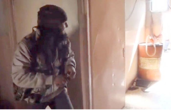 A still image taken from video shows a member of Daesh militants during clashes with Iraqi security forces on the outskirts of south-west Mosul. — Reuters