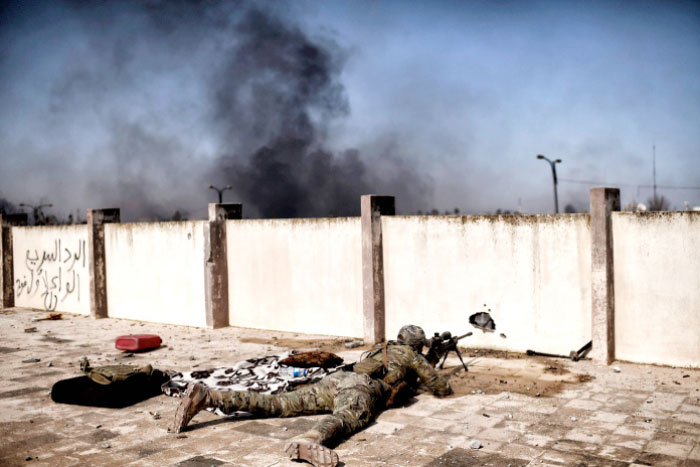A sniper fires at targets during clashes with Daesh group fighters in Mosul during an offensive to retake the western parts of the city from the militants. — AFP