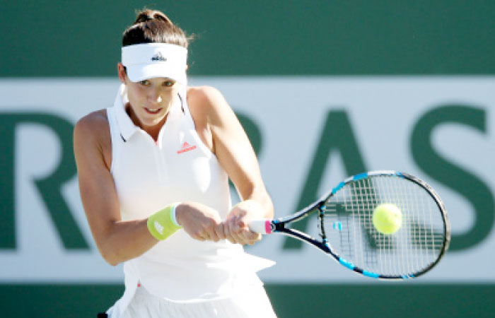 Garbine Muguruza of Spain plays Kayla Day during the BNP Paribas Open at the Indian Wells Tennis Garden on Sunday in Indian Wells, California.  — AFP