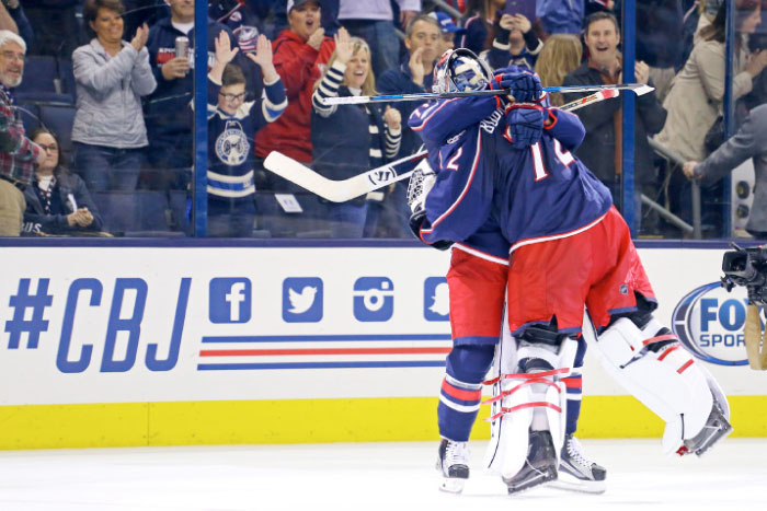 Columbus Blue Jackets’ goalie Sergei Bobrovsky (R) hugs left wing Nick Foligno after defeating the New Jersey Devils at Nationwide Arena in Columbus Tuesday. — Reuters