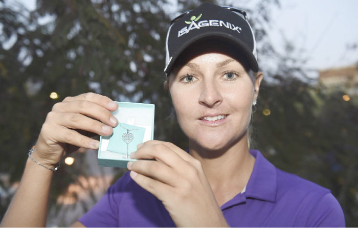 Anna Nordqvist of Sweden holds a Tiffany necklace representing her first win of the 2017 LPGA season after she won the Bank of Hope Founders Cup at Wildfire Golf Club at the JW Marriott Desert Ridge Resort on Sunday in Phoenix, Arizona.— AFP