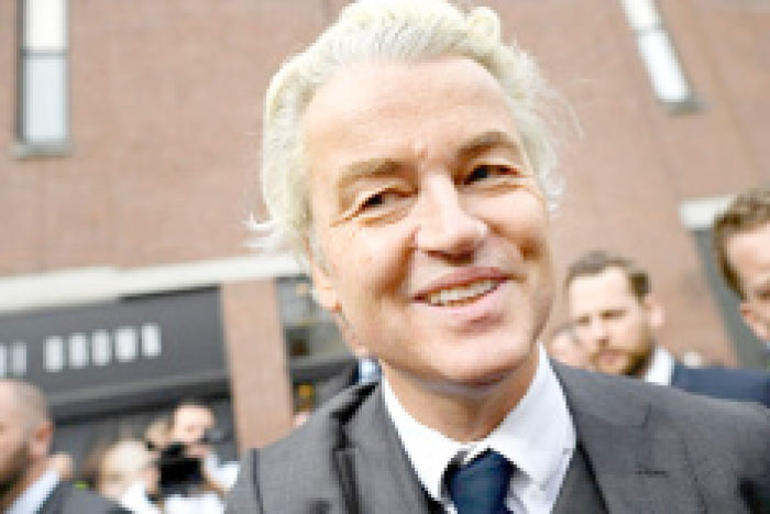 Dutch far-right politician Geert Wilders of the PVV party smiles during a rally in Heerlan, the Netherlands, on Saturday. — Reuters