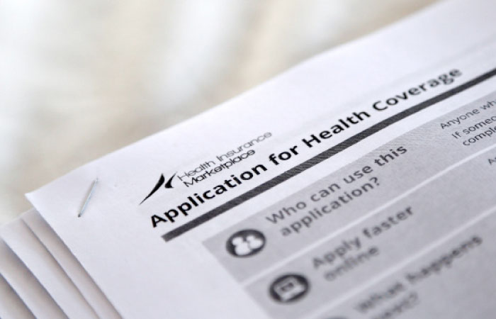 The federal government forms for applying for health coverage are seen at a rally held by supporters of the Affordable Care Act, widely referred to as “Obamacare”, outside the Jackson-Hinds Comprehensive Health Center in Jackson, Mississippi, in this Oct. 4, 2013 file photo. — Reuters