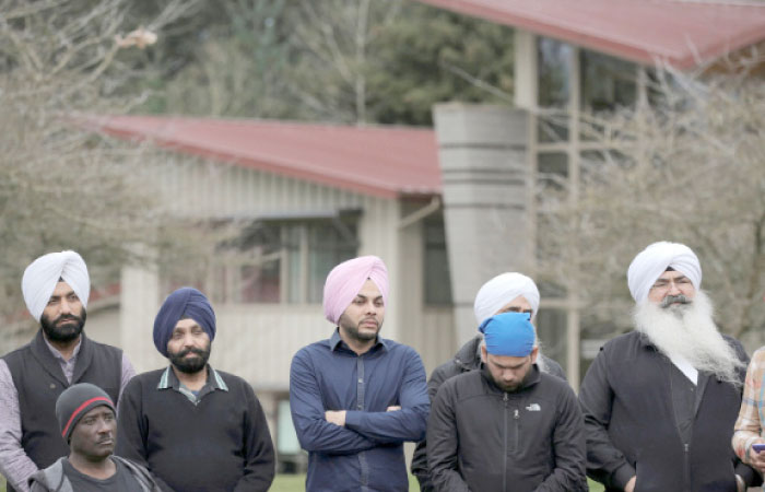 Sikh men listen during a vigil in honor of Srinivas Kuchibhotla, an immigrant from India who was recently shot and killed in Kansas, at Crossroads Park in Bellevue, Washington, on Sunday. — Reuters