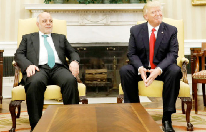 US President Donald Trump meets with Iraqi Prime Minister Haider Al-Abadi in the Oval Office at the White House in Washington on Monday. — Reuters