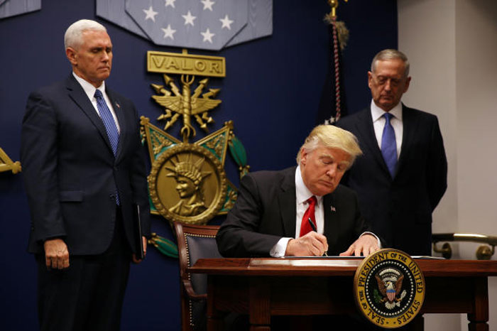 FILE PHOTO — US President Donald Trump signs an executive order for a US travel ban, at the Pentagon in Washington January 27, 2017. — Reuters