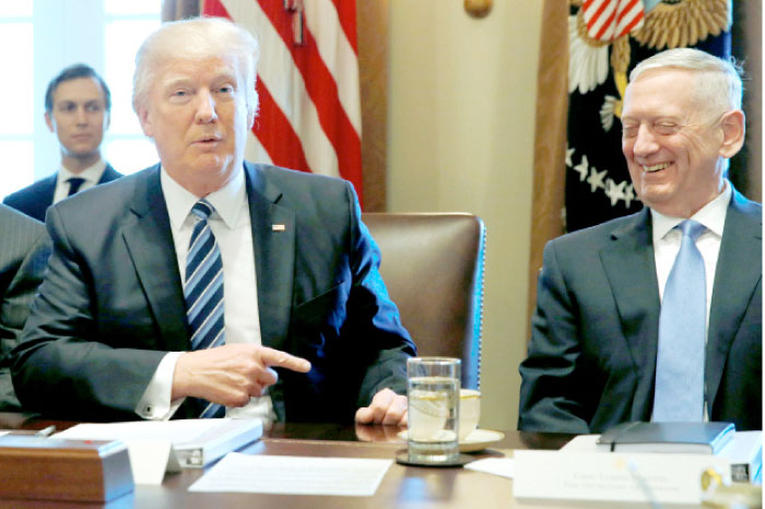 U.S. President Donald Trump, left, and Defense Secretary James Mattis, right, hold a Cabinet meeting at the White House in Washington on Monday. — Reuters