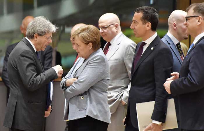 Italian Prime Minister Paolo Gentiloni , German Chancellor Angela Merkel and Austrian Chancellor Christian Kern, from left, are pictured at a round table meeting at an EU summit in Brussels on Saturday. — AP