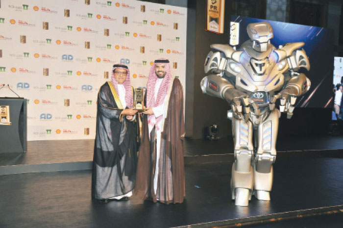 Mazin Ghazi Jameel, Executive Director of Marketing at ALJ, receives the trophies for the three awards — SG