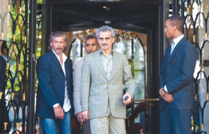 Prince Alwaleed at the entrance of Paris’ Four Seasons Hotel George V