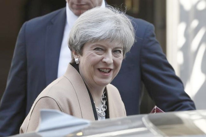 Britain's Prime Minister Theresa May leaves 10 Downing Street, to head for the House of Commons, in central London, Britain. — Reuters