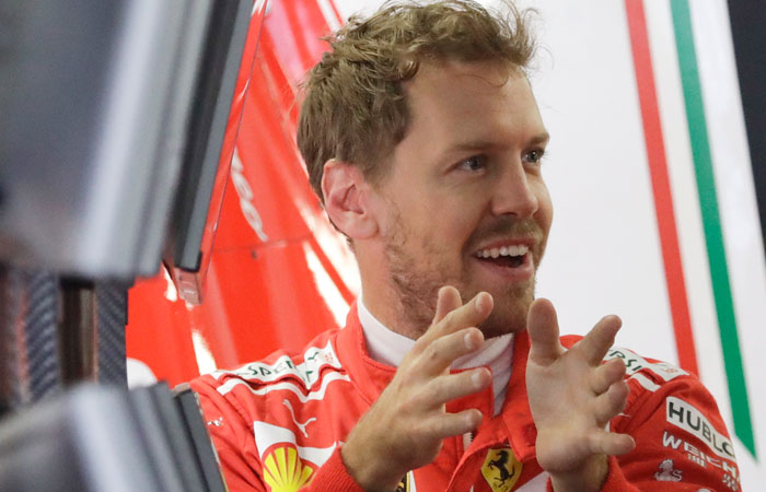 Ferrari driver Sebastian Vettel of Germany gestures in the Ferrari box during the first practice session ahead of the Russian Grand Prix at the 'Sochi Autodrom' circuit, in Sochi, Russia, Friday. — AP