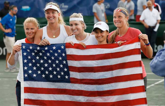 (L-R): Team USA members captain Kathy Rinaldi, Coco Vandeweghe, Bethanie Mattek-Sands, Lauren Davis and Shelby Rogers pose with the US flag as they celebrate their win against Czech Republic in the Fed Cup semifinals in Tampa, Florida Sunday. — AFP
