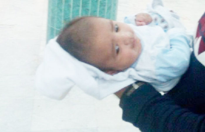 Forty-day-old Arhanuddin is probably the youngest expatriate to avail of the general amnesty to return home. — SG photo