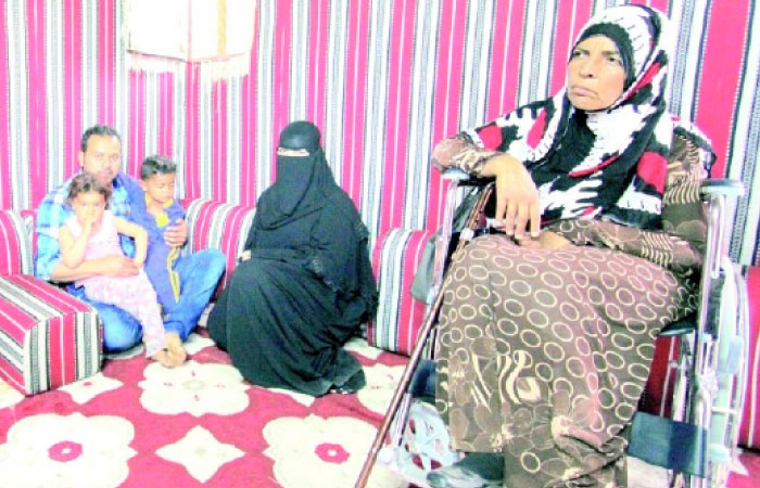 Malika Suwaid Al-Hizaimi with her children, husband Ahmad Mohammad and mother in Arar. — Okaz photo