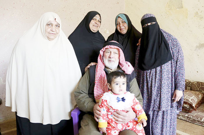 In this photo taken on Feb. 18, 2017, five generations of a Palestinian refugee family, the Abu Massouds, pose for a portrait. From left to right (standing): Bassama Abu Massoud, 72; her daughter Hanaa, 50; Hanaa’s daughter, Abir, 33; Abir’s daughter, Ala, 18. Patriarch Abdullah Abu Massoud, 77, sits in a chair, holding his 9-month-old great-great-granddaughter, Tuqaa, in his lap. — AP