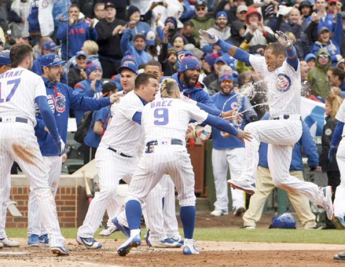 Chicago Cubs’ shortstop Addison Russell (R) celebrates his walk-off three run homer against the Milwaukee Brewers during their MLB game at Wrigley Field in Chicago Wednesday. — Reuters