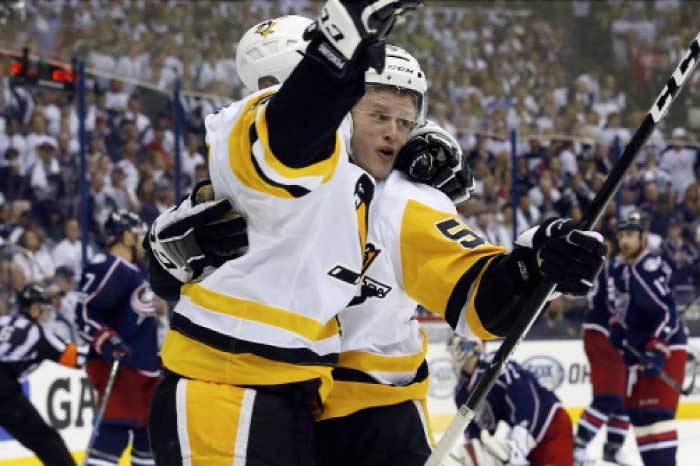 Pittsburgh Penguins center Jake Guentzel (59) and center Sidney Crosby (87) celebrate Guentzel's game winner during overtime in game three of the first round of the 2017 Stanley Cup Playoffs against the Columbus Blue Jackets at Nationwide Arena. — Reuters