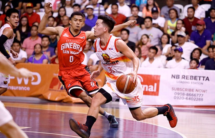 Phoenix's Matthew Wright goes on a drive as Ginebra's Paolo Taha defends in their PBA Commissioner's Cup road game in Davao City Saturday night.