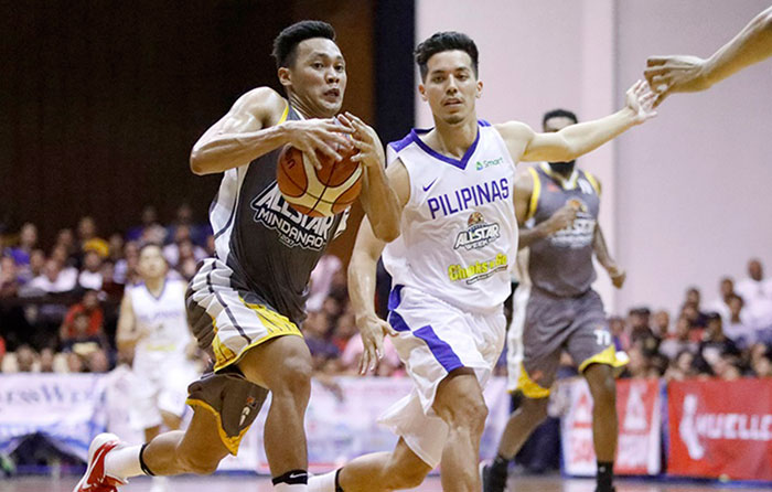 Mindanao All-Star Scottie Thompson is hounded by Gilas Pilipinas' Matthew Wright in the PBA All-Star Game in Cagayan de Oro City Wednesday night.