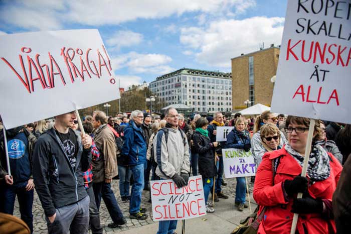Demonstrators hold placards during the “March for Science Stockholm” manifestation at Medborgarplatsen square in Stockholm, Sweden, on Saturday. — Reuters