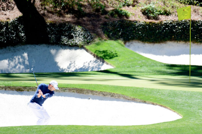 Sergio Garcia of Spain plays a shot from a bunker during the second round of the 2017 Masters Tournament at Augusta National Golf Club Friday. — AFP