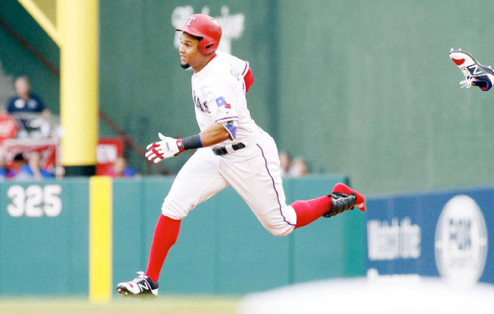 Texas Rangers’ center fielder Carlos Gomez loses his shoe as he rounds first base on a first inning double against the Los Angeles Angels during their MLB game at Globe Life Park in Arlington Saturday. — Reuters