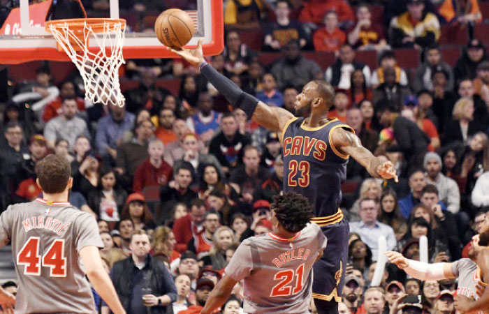 Cleveland Cavaliers’ forward LeBron James shoots the ball against the Chicago Bulls during their NBA game at the United Center in Chicago Thursday. — Reuters