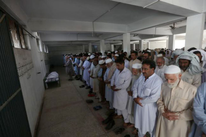 Pakistani relatives and residents offer funeral prayers for student Mashal Khan, who was killed by his classmates, during his funeral in Swabi district in the Khyber Pakhtunkhwa province on Friday. — AFP