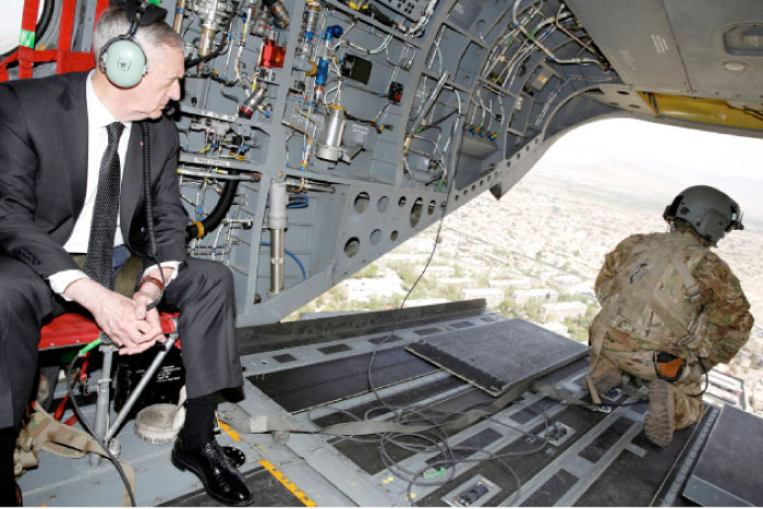 US Defense Secretary James Mattis looks out over Kabul as he arrives via helicopter at Resolute Support headquarters in Kabul on Monday. — Reuters