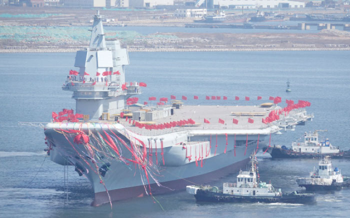China’s first domestically built aircraft carrier is seen during its launching ceremony in Dalian, Liaoning province, China, on Wednesday. — Reuters