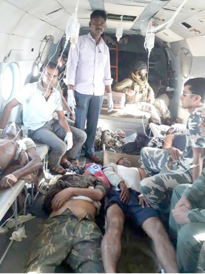 Wounded Indian security personnel are being treated in an army helicopter as they are airlifted to a hospital following an attack by Maoist rebels in Sukma district of Chhattisgargh state on Monday. — AFP