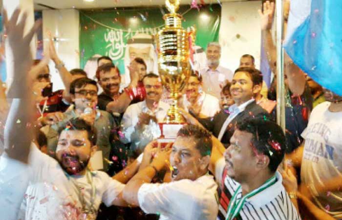 Abeer Premier League champion Medispo Sharafiya players celebrate with the trophy