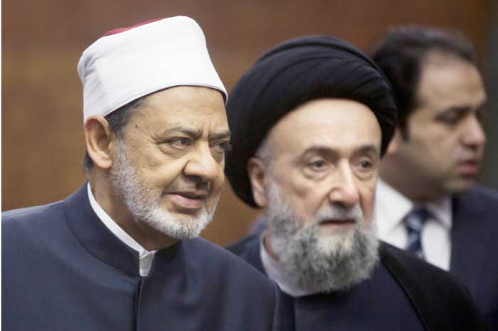 Sheikh Ahmed Al-Tayeb, Grand Imam of Al-Azhar (left) accompanies the former mufti of the city of Tyre and Mount Amil in southern Lebanon during the second round of meetings between the Muslim Council of Elders and the World Council of Churches at Al-Azhar headquarters in Cairo, Wednesday. — AFP